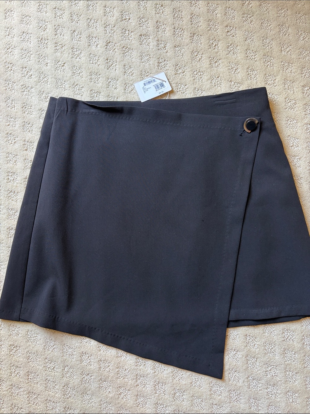 Asymmetrical Black Wrap Skirt with Metal Ring Accent